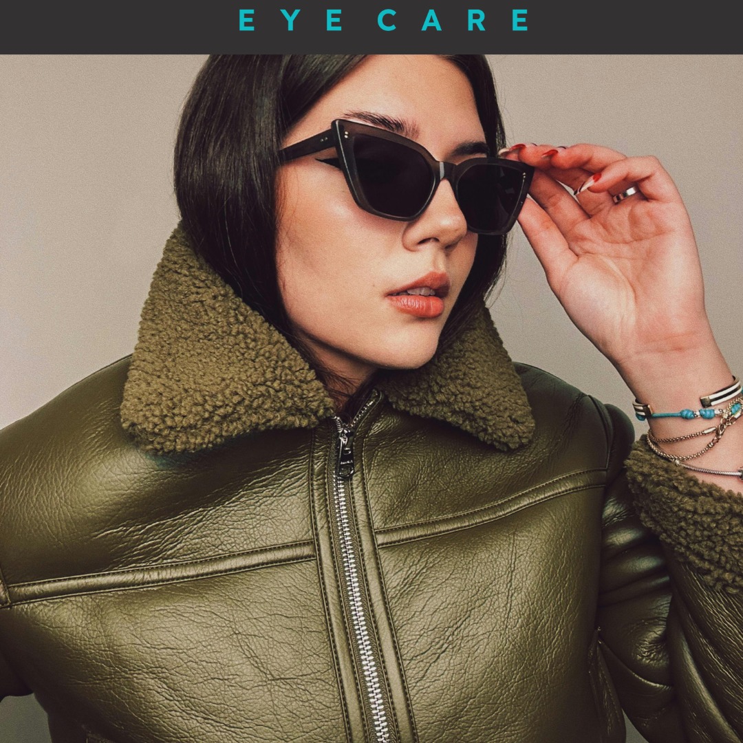 Woman wearing trendy sunglasses and a stylish green jacket, showcasing fashionable eyewear for eye care and style.